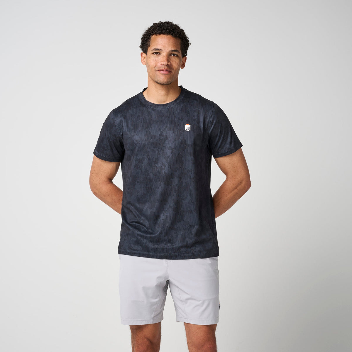 Greatness Wins Men's Core Tech Tee | Black Camo