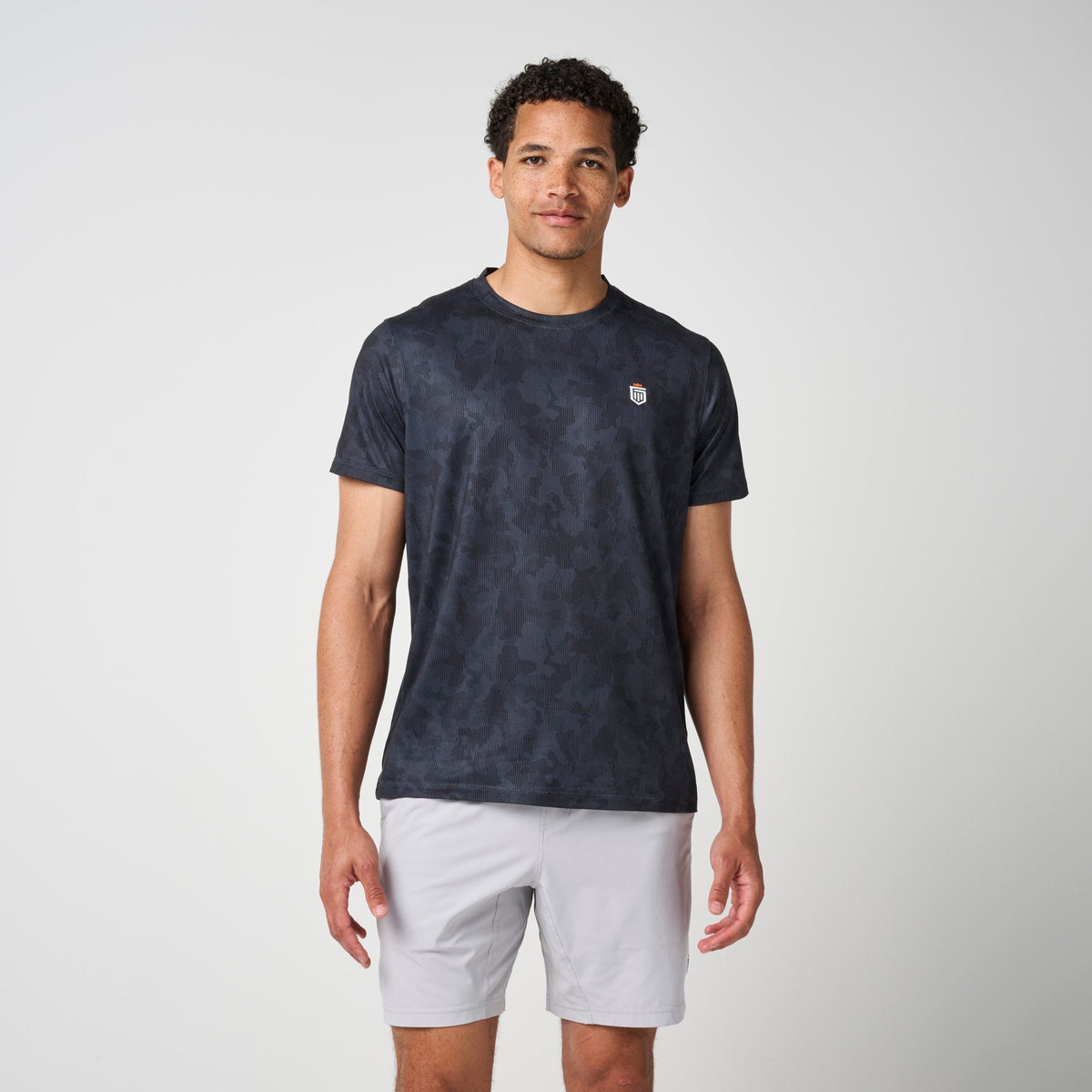 Greatness Wins Men's Core Tech Tee | Black Camo